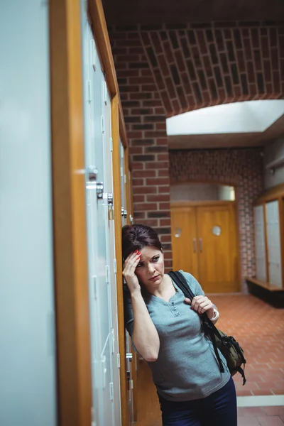 Stressed mature student in locker room — Stock Photo, Image