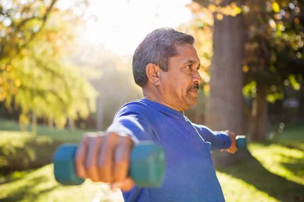 Man exercising with dumbbell — Stock Photo, Image