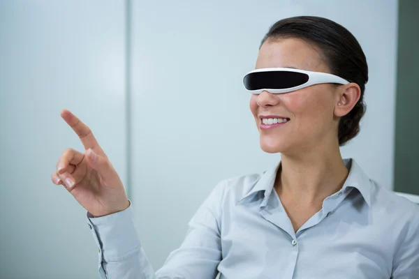 Woman using virtual video glasses — Stock Photo, Image