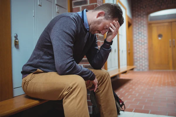 Stressed mature student in locker room — Stock Photo, Image