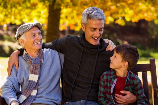 Man with father and son at park — Stock Photo, Image
