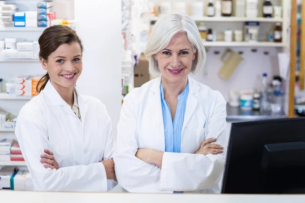 Pharmacists standing with arms crossed — Stock Photo, Image