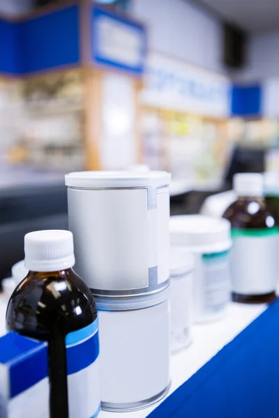 Various boxes and bottles of medicine on table — Stock Photo, Image