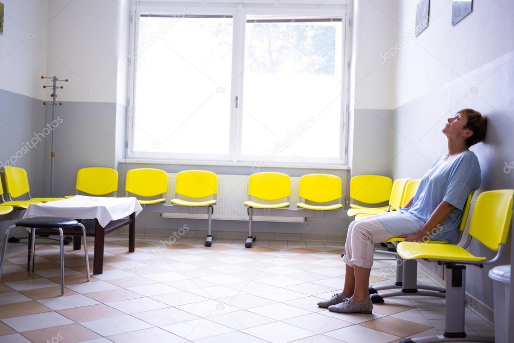 Patient Sitting In A Waiting Room — Stock Photo © Wavebreakmedia 123943110