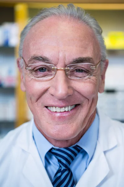 Pharmacist smiling in pharmacy — Stock Photo, Image