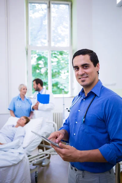 Confident doctor using digital tablet — Stock Photo, Image