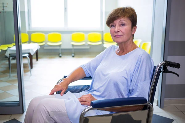 Sad senior patient sitting on a wheelchair — Stock Photo, Image