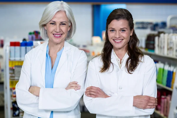 Pharmacists standing with arms crossed — Stock Photo, Image