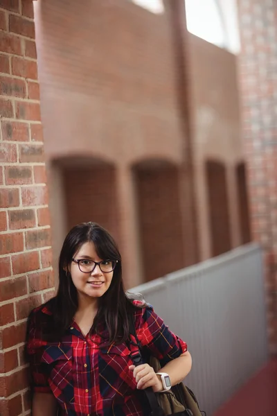 Female student standing in corridor — Stock Photo, Image