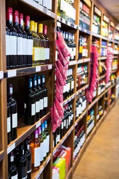 Wine bottles in grocery section — Stock Photo, Image