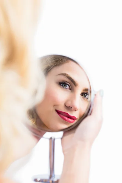 Beautiful woman in hand mirror — Stock Photo, Image