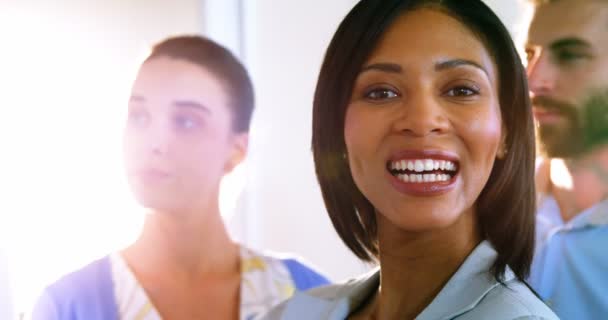 Portrait of female business executives smiling at camera — Stockvideo