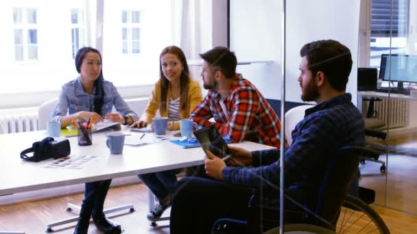 Graphic designers discussing over photographs — Stock video