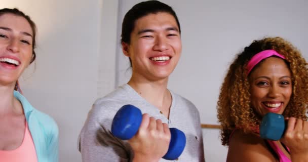 Group of fitness team holding dumbbell — Stock Video