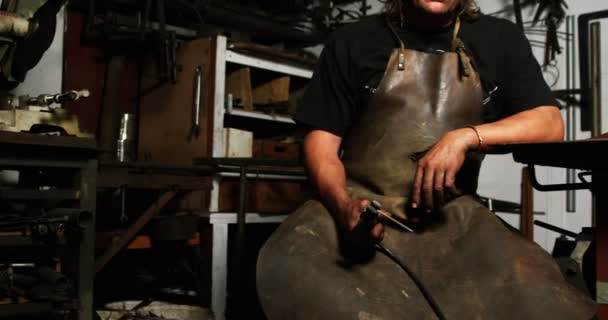 Welder sitting with welding arch — Stock Video