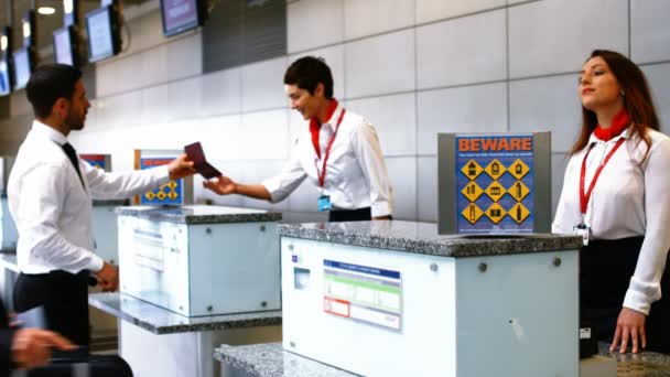 Airport staff checking passport — Stock Video