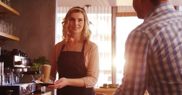 Waitress serving a glass of cold coffee — Stock Video