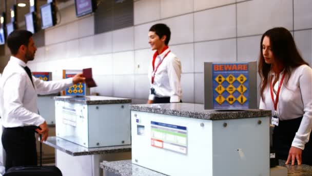 Airport staff checking passport — Stock Video