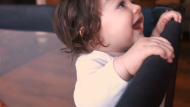 Baby girl in baby cot — Stock Video