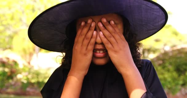 Girl pretending to be a witch — Stock Video