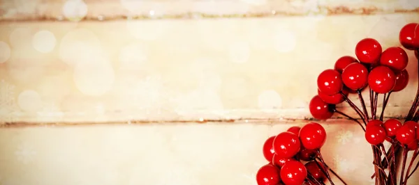 Fake red cherries on a plank — Stock Photo, Image