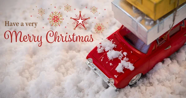 Leksaksbil som transporterar julklapp — Stockfoto