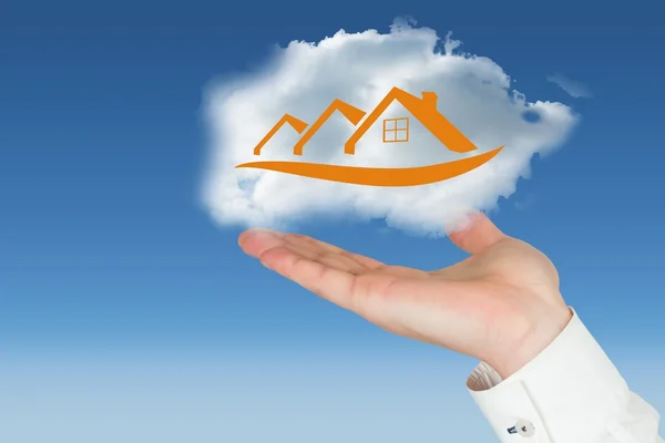 Hand carrying house in a cloud — Stock Photo, Image