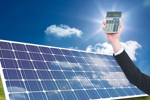 Hand holding calculator with solar panel — Stock Photo, Image