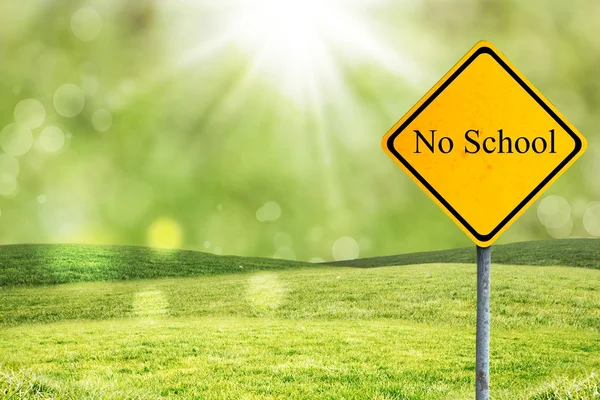 No school sign with green field