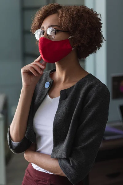 Mixed Race Woman Wearing Mask Office Standing Rubbing Her Chin — Stock Photo, Image