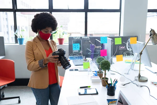 Mixed Race Businesswoman Wearing Face Mask Using Camera Creative Office — Stock Fotó