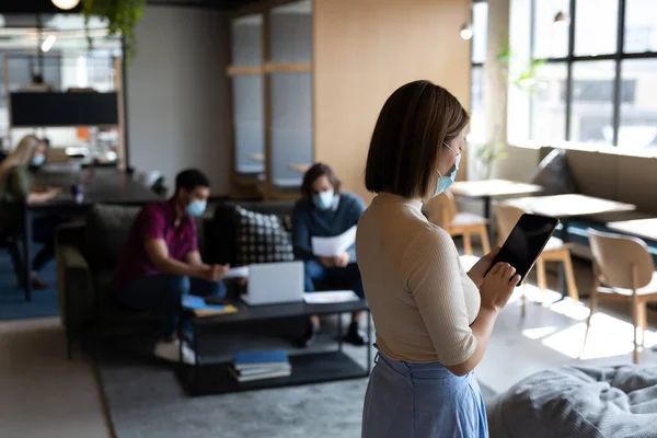 Asian Businesswoman Wearing Face Mask Using Tablet Creative Office Social — Stock Photo, Image