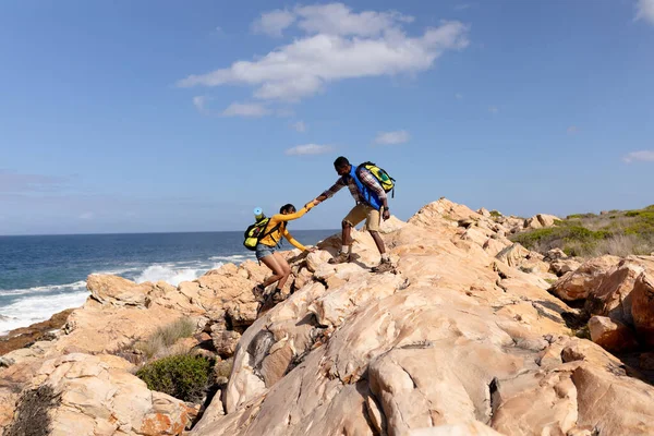 Fit African American Couple Wearing Backpacks Hiking Coast Healthy Lifestyle — 图库照片