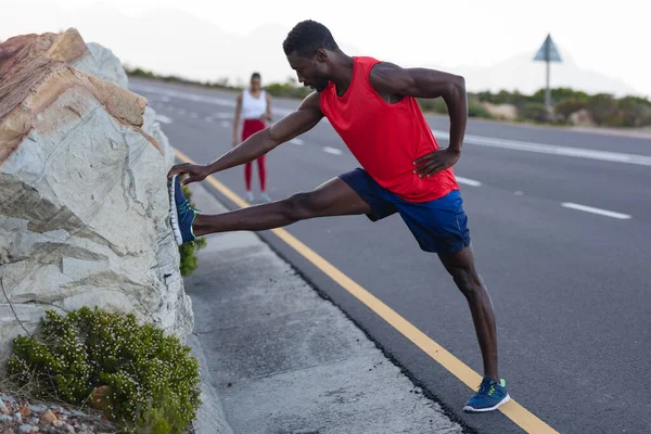 Fit African American Man Sportswear Stretching Coastal Road Healthy Lifestyle — Stock fotografie