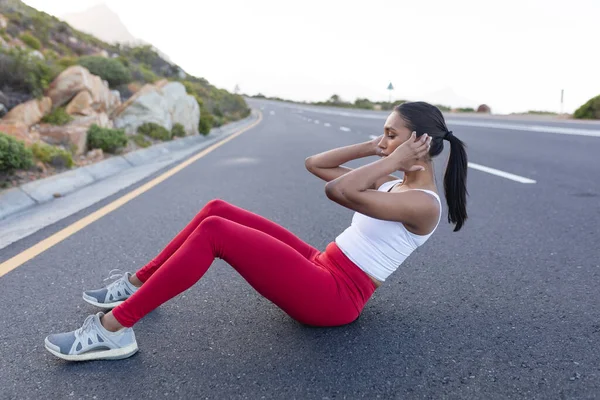 Fit African American Woman Sportswear Doing Crunches Coastal Road Healthy — Zdjęcie stockowe