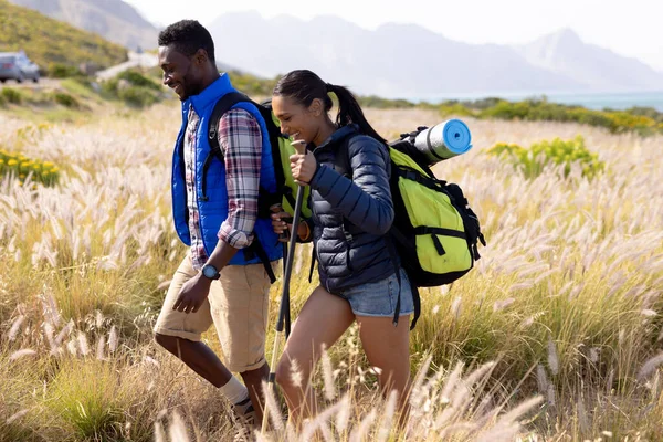 Fit African American Couple Wearing Backpacks Nordic Walking Poles Mountain — Stockfoto