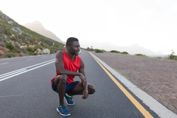 Fit African American Man Sportswear Stretching Coastal Road Healthy Lifestyle — Zdjęcie stockowe