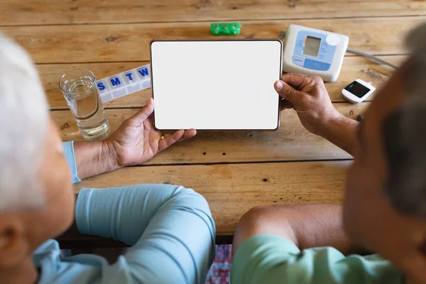 Senior African American Couple Medication Using Digital Tablet Kitchen Table — Stock Photo, Image