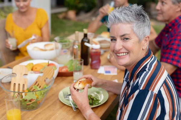 Portrait Smiling Caucasian Senior Woman Holding Hot Dog Table Family — Stock Photo, Image