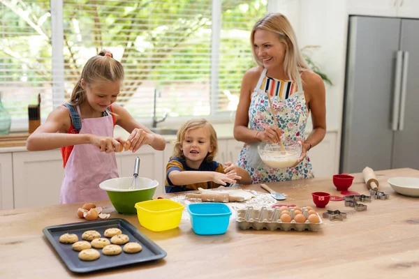 Happy Caucasian Mother Kitchen Daughter Son Wearing Aprons Baking Cookies — Stock Photo, Image