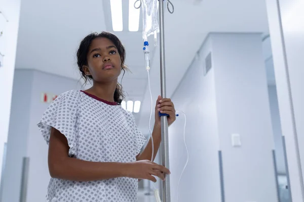 Sick Mixed Race Girl Walking Hospital Corridor Drip Bag Stand — Stock Photo, Image