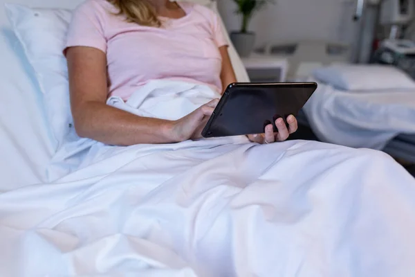 Midsection Caucasian Female Patient Lying Hospital Bed Using Digital Tablet —  Fotos de Stock