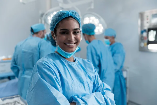 Smiling Mixed Race Female Surgeon Face Mask Protective Clothing Operating — Stockfoto