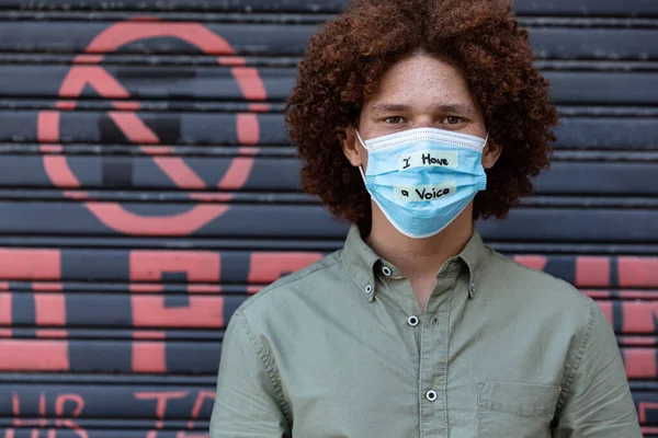 Portrait Mixed Race Man Wearing Face Mask Writing Equal Rights — Stock Photo, Image
