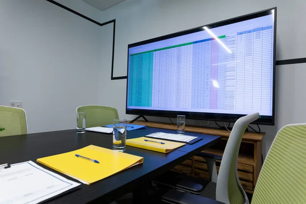 Office Table Computer Monitor Documents Glasses Water Business Items Modern — Stock Photo, Image