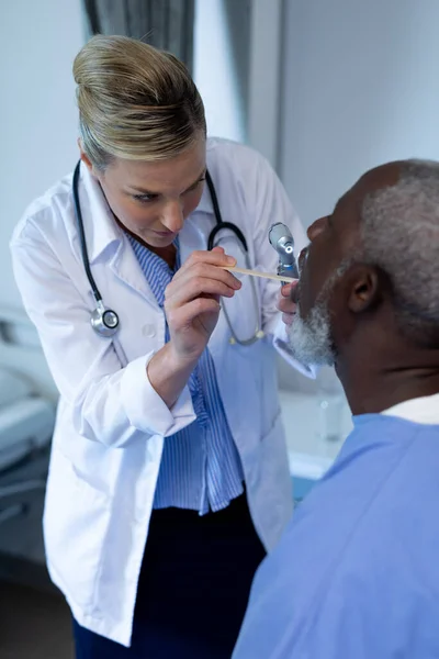 Caucasian Female Doctor Examining Throat African American Male Patient Medicine — Stock Photo, Image
