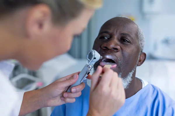 Caucasian Female Doctor Examining Throat African American Male Patient Medicine — Stock Photo, Image