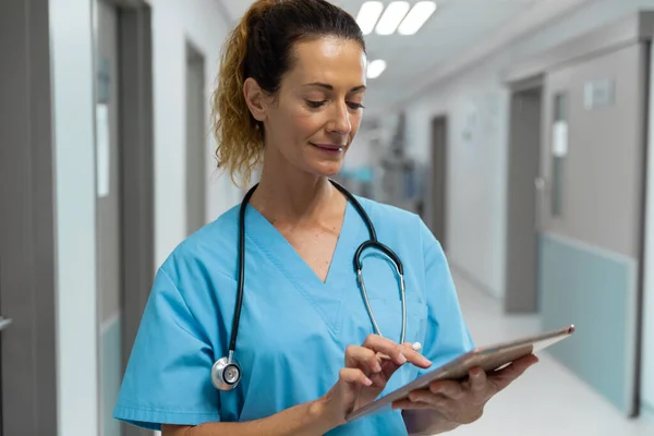 Portrait Mixed Race Female Doctor Standing Hospital Corridor Using Tablet — Stock Photo, Image