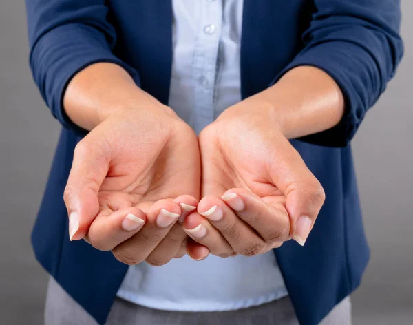 Mid Section Businesswoman Cupped Hands Grey Background Business Professionalism Technology — Stock Photo, Image