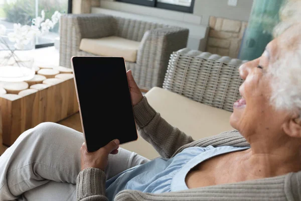 Mixed Race Senior Woman Sitting Sofa Using Tablet Staying Home — Stock Photo, Image